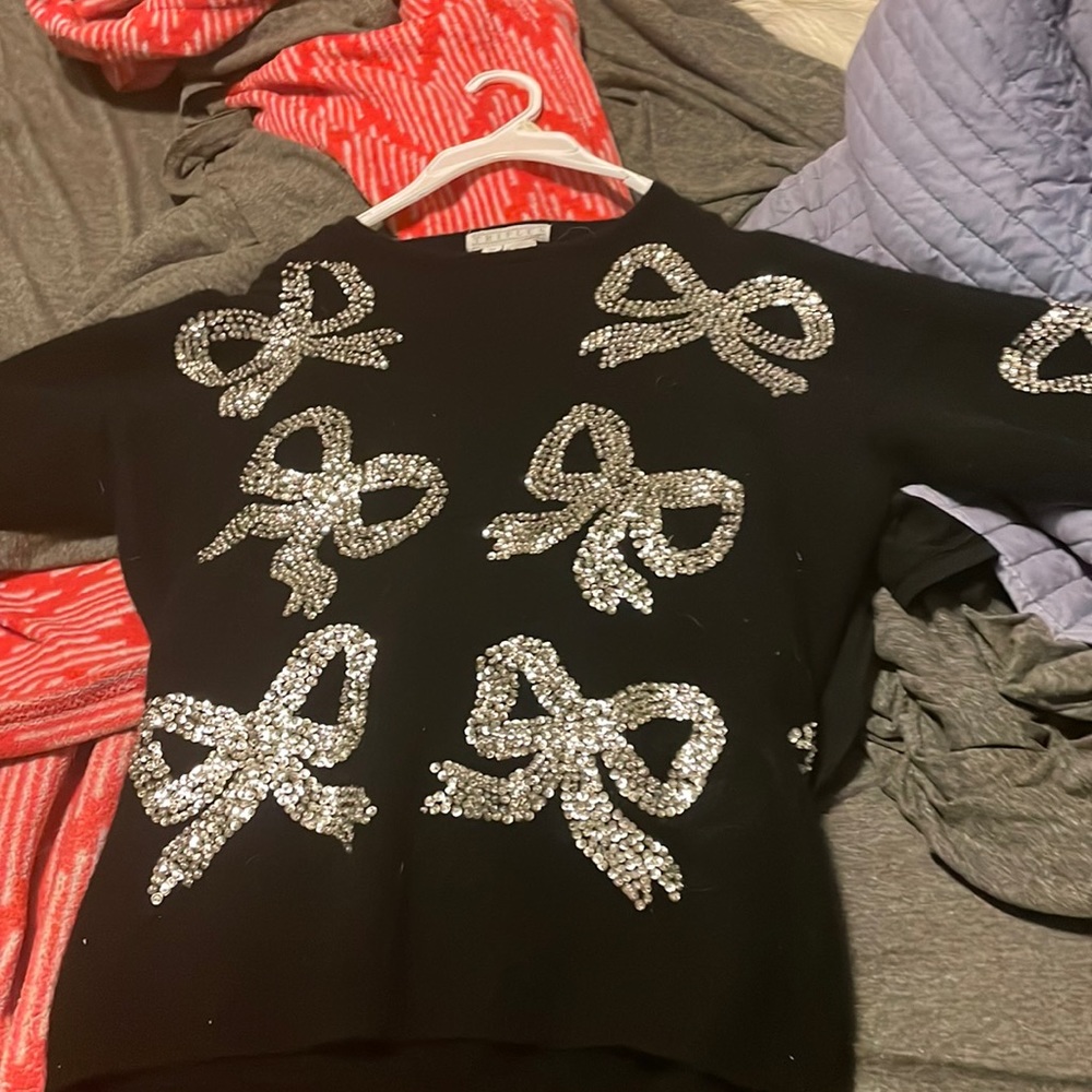Cashmere wool black holiday sweater with sequins.